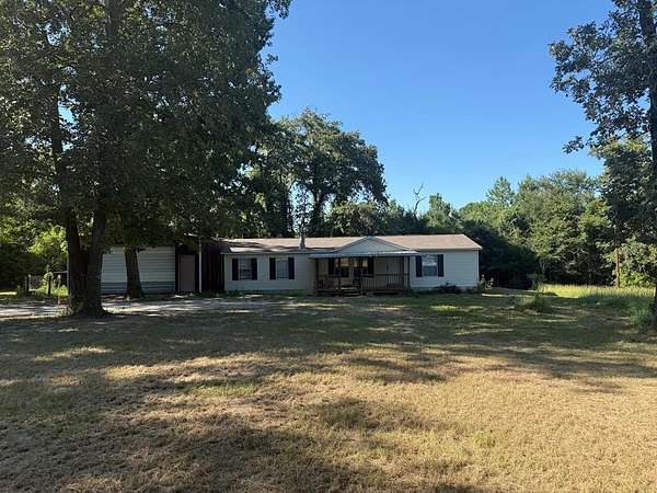 10.5 Acres of Land with Home for Sale in Elkhart, Texas
