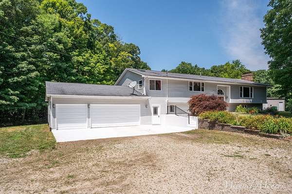 6.75 Acres of Land with Home for Sale in Sand Lake, Michigan