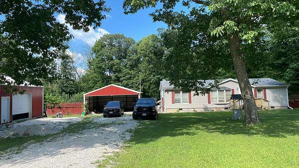 2.5 Acres of Land with Home for Sale in Humansville, Missouri