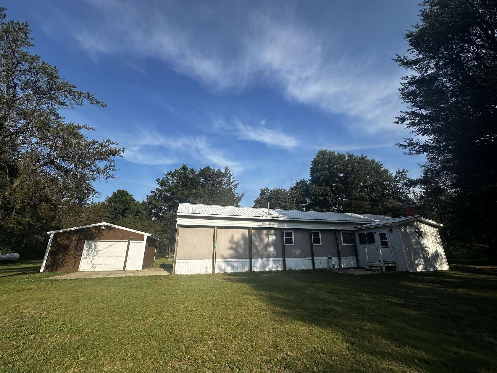 10 Acres of Recreational Land with Home for Sale in Irons, Michigan