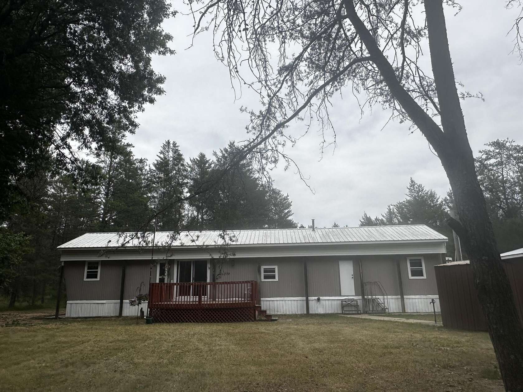 10 Acres of Recreational Land with Home for Sale in Irons, Michigan