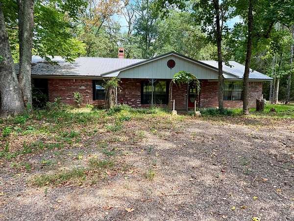 8.36 Acres of Land with Home for Sale in Timpson, Texas
