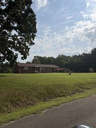 8 Acres of Land with Home for Auction in Lexington, Tennessee
