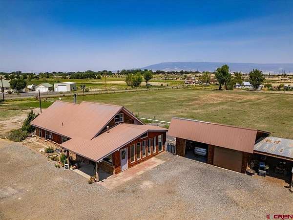 14.7 Acres of Land with Home for Sale in Delta, Colorado