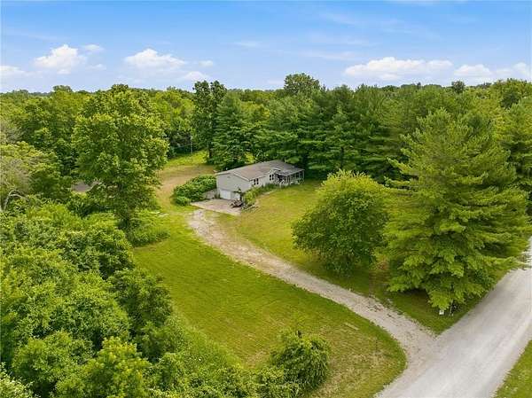 4.37 Acres of Land with Home for Sale in Peculiar, Missouri