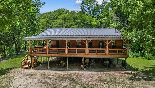 8.47 Acres of Land with Home for Sale in Colmesneil, Texas