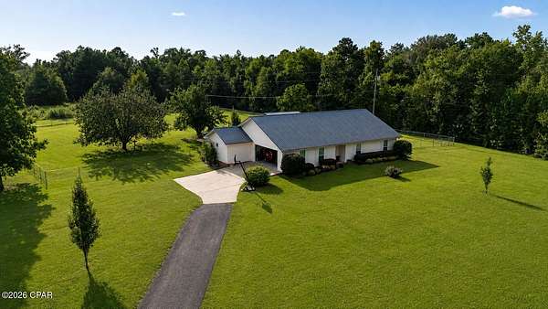7.9 Acres of Land with Home for Sale in Marianna, Florida