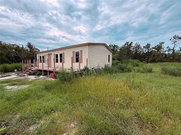 3.85 Acres of Land with Home for Sale in Spring Hill, Florida
