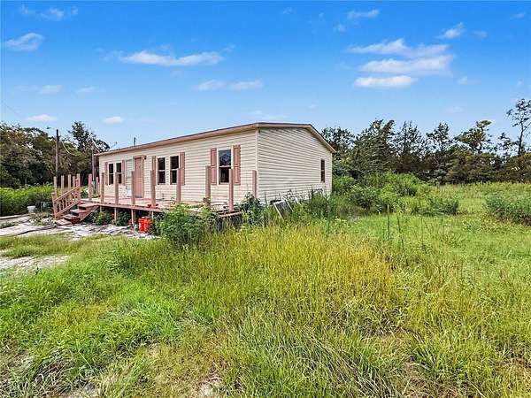 3.85 Acres of Land with Home for Sale in Spring Hill, Florida