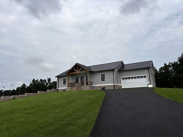 1.5 Acres of Land with Home for Sale in Burns, Tennessee