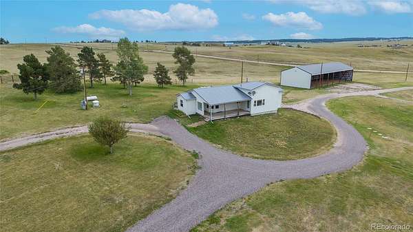 60 Acres of Agricultural Land with Home for Sale in Elizabeth, Colorado
