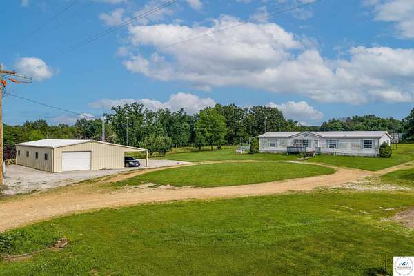 26.8 Acres of Agricultural Land with Home for Sale in Mora, Missouri