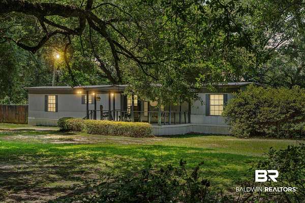 1.56 Acres of Land with Home for Sale in Irvington, Alabama