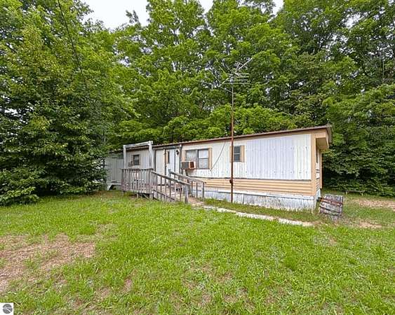 10.5 Acres of Recreational Land with Home for Sale in Fife Lake, Michigan