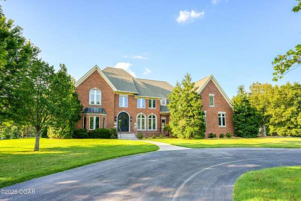 6.54 Acres of Land with Home for Sale in Carthage, Missouri