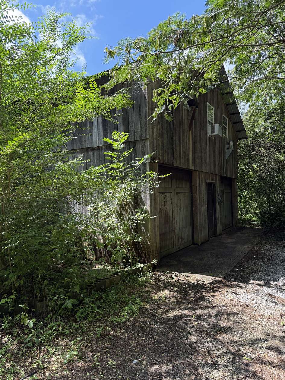 17.7 Acres of Recreational Land with Home for Sale in Ashland City, Tennessee