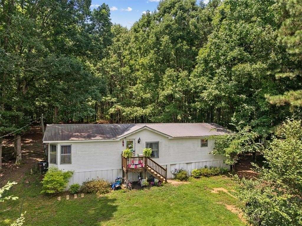 10 Acres of Land with Home for Sale in Plainville, Georgia