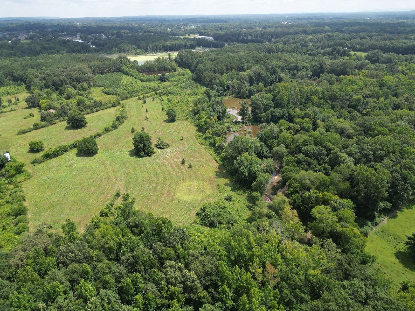 97 Acres of Land with Home for Sale in Hartselle, Alabama