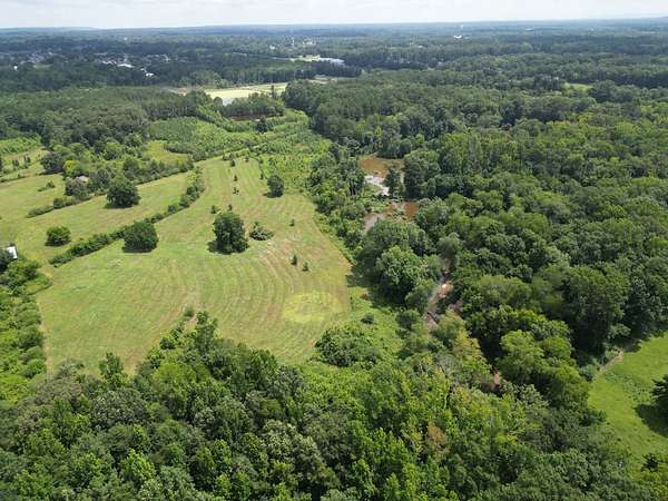 97 Acres of Land with Home for Sale in Hartselle, Alabama