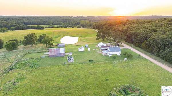156 Acres of Land with Home for Sale in Cross Timbers, Missouri