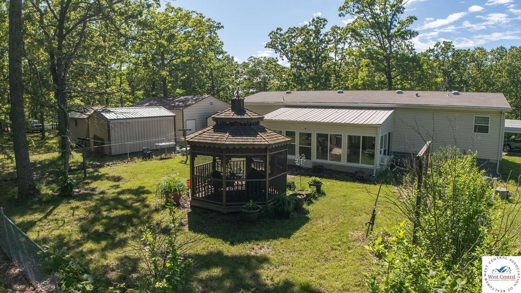 1.5 Acres of Land with Home for Sale in Lowry City, Missouri