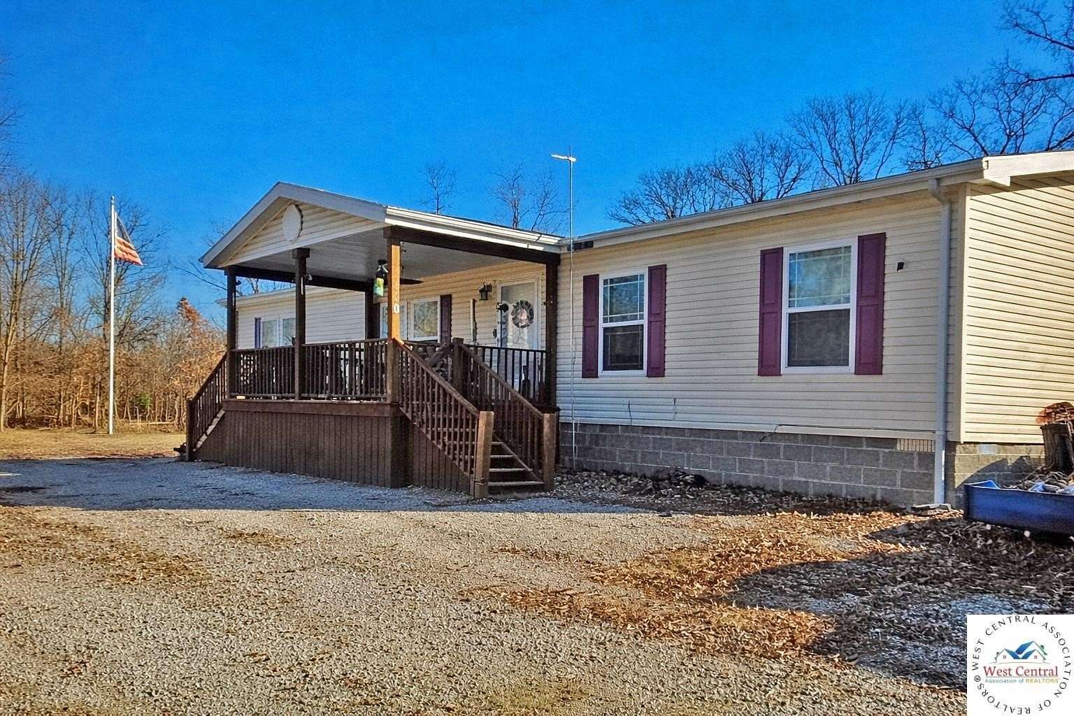 1.5 Acres of Land with Home for Sale in Lowry City, Missouri
