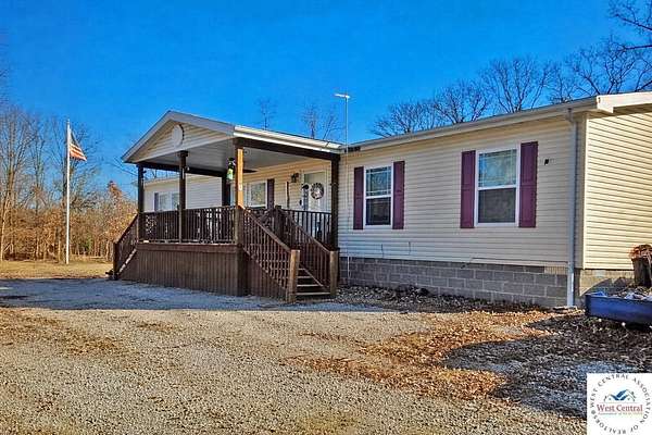 1.5 Acres of Land with Home for Sale in Lowry City, Missouri