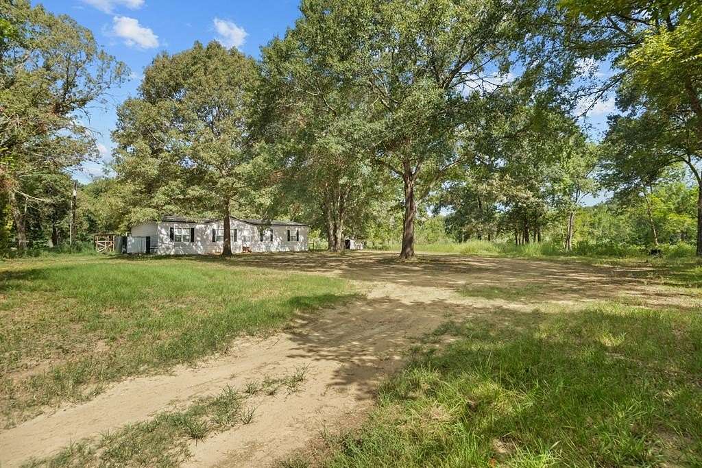 5.1 Acres of Land with Home for Sale in Palestine, Texas