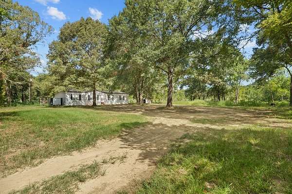 5.1 Acres of Land with Home for Sale in Palestine, Texas