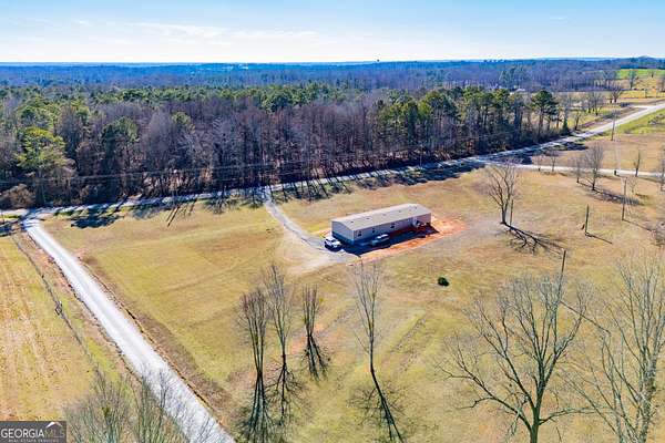 6.39 Acres of Land with Home for Sale in Roopville, Georgia