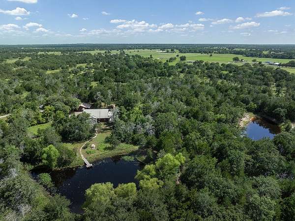 21.4 Acres of Recreational Land with Home for Sale in Carmine, Texas