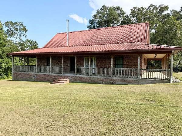 9.82 Acres of Land with Home for Sale in Carriere, Mississippi