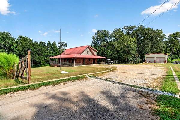 9.82 Acres of Land with Home for Sale in Carriere, Mississippi