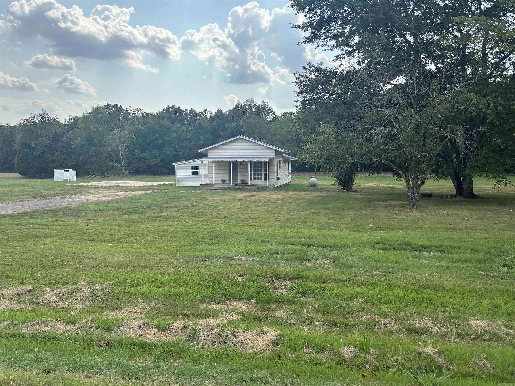 4 Acres of Land with Home for Sale in Romance, Arkansas