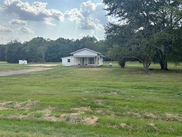 4 Acres of Land with Home for Sale in Romance, Arkansas