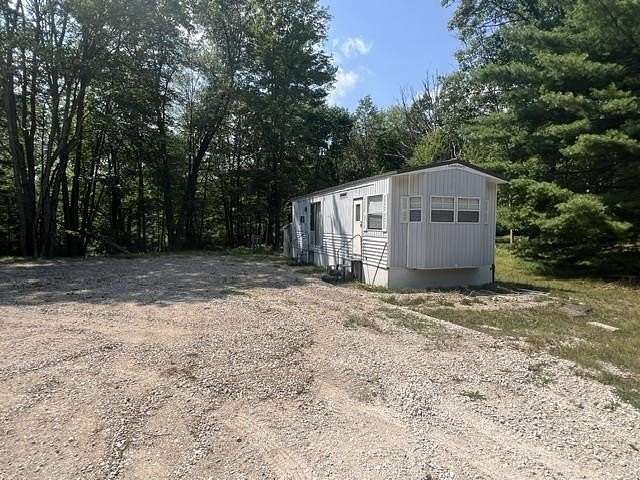 1.14 Acres of Land with Home for Sale in Harrison, Michigan
