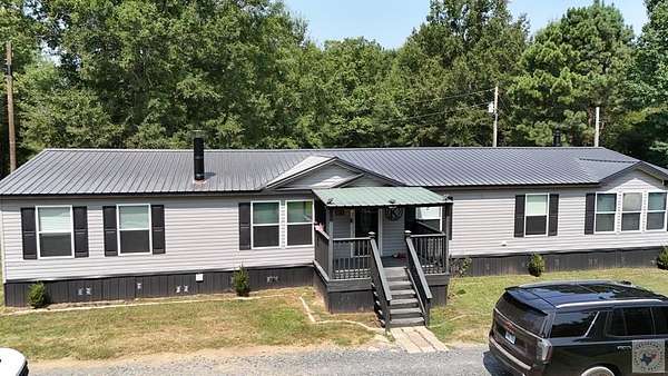 13.2 Acres of Land with Home for Sale in Fouke, Arkansas
