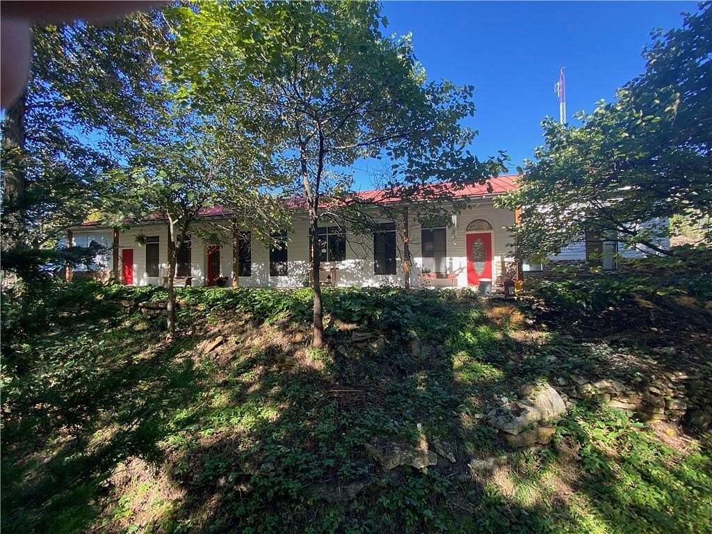 23.3 Acres of Land with Home for Sale in Centerview, Missouri