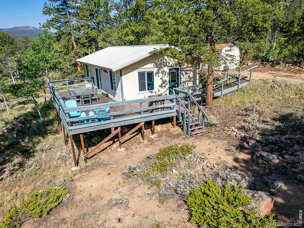 2 Acres of Land with Home for Sale in Red Feather Lakes, Colorado