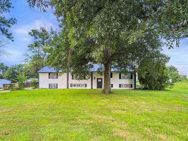 11.5 Acres of Land with Home for Sale in Harrisonville, Missouri
