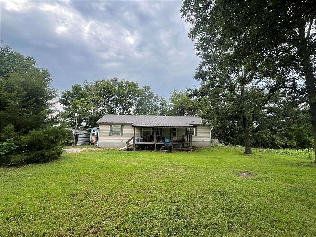 10 Acres of Land with Home for Sale in Adrian, Missouri