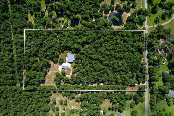 10 Acres of Land with Home for Sale in Plantersville, Texas
