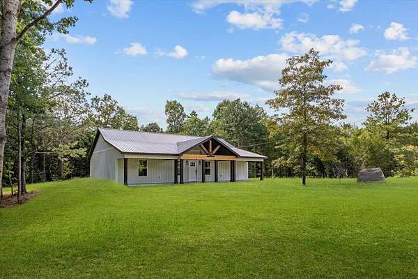 1.73 Acres of Land with Home for Sale in Camden, Tennessee