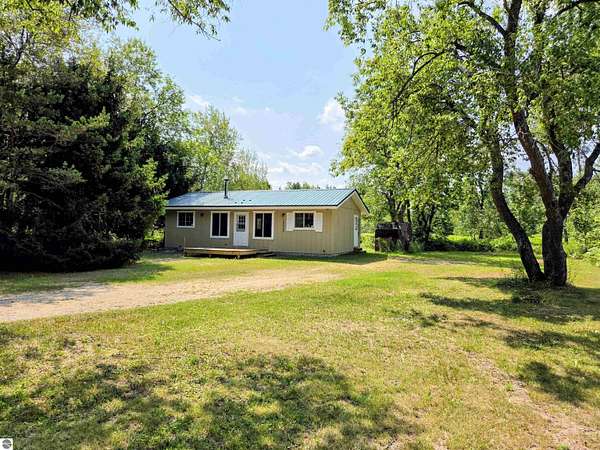 2.87 Acres of Land with Home for Sale in Mancelona, Michigan