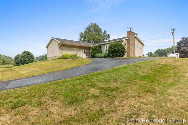 1.5 Acres of Land with Home for Sale in Sheridan, Michigan