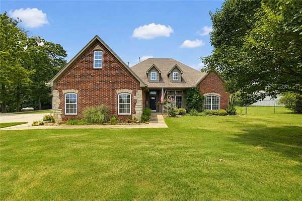 5.24 Acres of Land with Home for Sale in Gravette, Arkansas