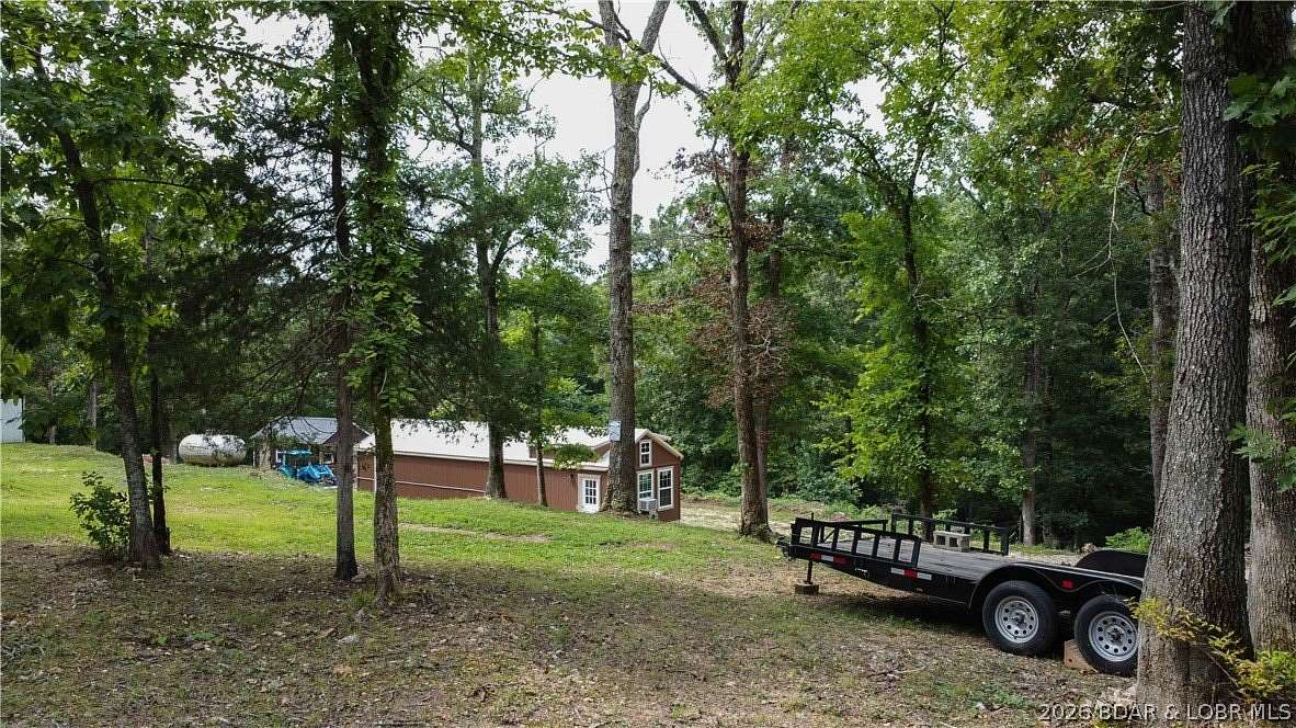 7.69 Acres of Land with Home for Sale in Barnett, Missouri
