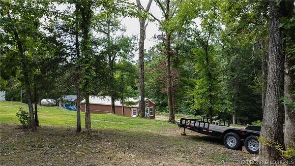 7.69 Acres of Land with Home for Sale in Barnett, Missouri