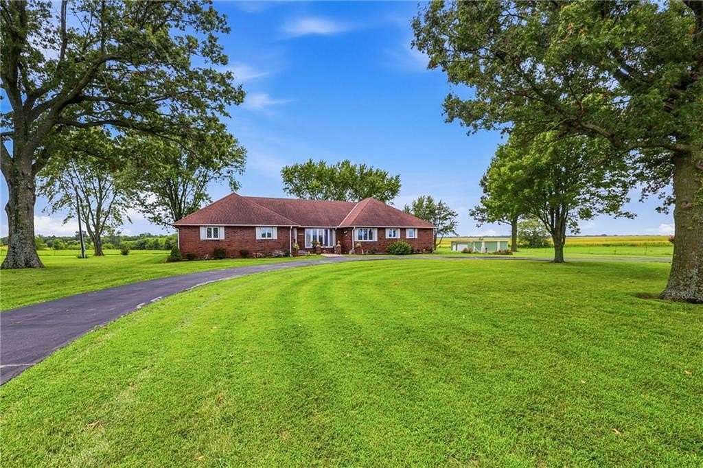 10.6 Acres of Land with Home for Sale in Harrisonville, Missouri