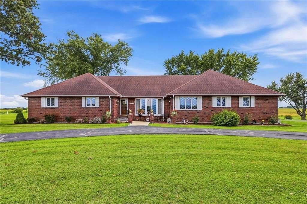 10.6 Acres of Land with Home for Sale in Harrisonville, Missouri